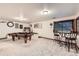 Basement game room with a pool table and bistro table set, perfect for entertaining at 1013 E 130Th Dr, Thornton, CO 80241