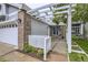Inviting entrance with a pergola and brick accents leading to the front door at 1013 E 130Th Dr, Thornton, CO 80241