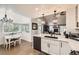 Bright, modern kitchen with breakfast nook and hardwood floors at 1013 E 130Th Dr, Thornton, CO 80241
