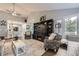 Open living room with vaulted ceilings, fireplace and view of kitchen at 1013 E 130Th Dr, Thornton, CO 80241