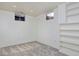 Finished basement room with built-in shelving and carpet at 1000 Collyer St, Longmont, CO 80501