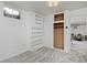 Finished basement room with built-in shelving and closet at 1000 Collyer St, Longmont, CO 80501