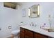 Basement bathroom with wood vanity and marble top at 1000 Collyer St, Longmont, CO 80501