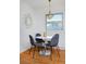 Dining area features a round table with four gray chairs at 1000 Collyer St, Longmont, CO 80501