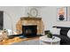 Stone fireplace adds warmth and character to the living room at 1000 Collyer St, Longmont, CO 80501