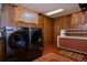 Basement laundry room with washer, dryer, and shelving at 1000 Collyer St, Longmont, CO 80501