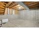 Unfinished basement with concrete walls and exposed ceiling for potential renovations at 2910 S Racine St, Aurora, CO 80014