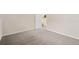 Bedroom features soft carpeting and leads to stairs at 2910 S Racine St, Aurora, CO 80014
