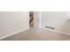 Bright bedroom with plush carpeting leads to stairs at 2910 S Racine St, Aurora, CO 80014