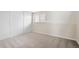 Neutral bedroom with a large window, closet and plush carpeting at 2910 S Racine St, Aurora, CO 80014