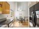 Bright dining room with a glass table and stainless steel refrigerator at 2910 S Racine St, Aurora, CO 80014