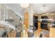 Open kitchen and dining area with stainless steel appliances and modern finishes at 2910 S Racine St, Aurora, CO 80014