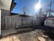 Fenced backyard with a storage shed, perfect for outdoor activities and relaxation at 4785 Estes St, Wheat Ridge, CO 80033