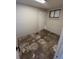 A view of the basement with light grey painted walls and a door to another part of the basement at 4785 Estes St, Wheat Ridge, CO 80033