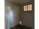 Basement leading to doorway, window and brick accent wall at 4785 Estes St, Wheat Ridge, CO 80033