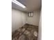 A view of the basement with light grey painted walls and a door to another part of the basement at 4785 Estes St, Wheat Ridge, CO 80033