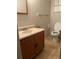 Bathroom with a vanity, toilet, neutral paint, and standard fixtures at 4785 Estes St, Wheat Ridge, CO 80033