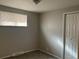 Neutral bedroom featuring carpet, one window with blinds, and a closet at 4785 Estes St, Wheat Ridge, CO 80033