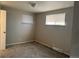 Neutral bedroom featuring carpet, two windows with blinds, and fresh paint at 4785 Estes St, Wheat Ridge, CO 80033