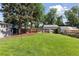 Spacious backyard with lush lawn and fenced perimeter at 3976 S Washington St, Englewood, CO 80113