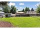 Large backyard with a shed and greenhouse at 3976 S Washington St, Englewood, CO 80113
