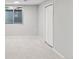 Finished basement with window, closet and neutral carpet at 3976 S Washington St, Englewood, CO 80113