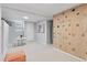 Finished basement area with climbing wall, play area and neutral carpeting at 3976 S Washington St, Englewood, CO 80113