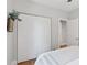Bedroom showcasing closet with doors, neutral paint, and hardwood floors at 3976 S Washington St, Englewood, CO 80113