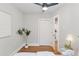 Bedroom featuring wood floors, a ceiling fan, and an adjacent closet at 3976 S Washington St, Englewood, CO 80113