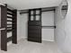 Walk-in closet with custom shelving and drawers to maximize storage at 3976 S Washington St, Englewood, CO 80113