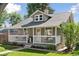 View of house featuring a cozy front porch perfect for relaxing and enjoying the outdoors at 3976 S Washington St, Englewood, CO 80113