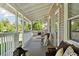 Inviting front porch with comfortable seating, creating a relaxing outdoor space for leisure and enjoyment at 3976 S Washington St, Englewood, CO 80113