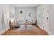 Bright living room with natural light, stylish furniture, and hardwood floors at 3976 S Washington St, Englewood, CO 80113