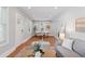 Open concept living room with hardwood floors, modern decor, and plenty of natural light at 3976 S Washington St, Englewood, CO 80113