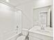 Bright bathroom with a shower-tub combo, modern fixtures, and a vanity with ample countertop space at 559 Homestead Ave, Brighton, CO 80601