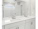 Elegant bathroom with double vanity, large mirror, and modern fixtures, creating a luxurious space at 559 Homestead Ave, Brighton, CO 80601