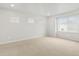 Bright bedroom featuring three windows, recessed lighting and plush carpet, providing a relaxing retreat at 559 Homestead Ave, Brighton, CO 80601