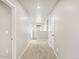 Bright hallway featuring neutral carpet and walls providing seamless transition between living spaces at 559 Homestead Ave, Brighton, CO 80601