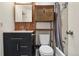 Bathroom featuring modern wood accents, updated vanity and shower/tub combination at 1830 Newland Ct # 101, Lakewood, CO 80214