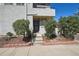 The front entrance features a neutral exterior, clean landscaping, and a short walk up to the front door at 1830 Newland Ct # 101, Lakewood, CO 80214