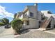 Attractive exterior of the townhome featuring a modern design and a private balcony overlooking the neighborhood at 1830 Newland Ct # 101, Lakewood, CO 80214