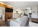 Open-concept living area with sofa, exercise equipment and a view into the kitchen at 1830 Newland Ct # 101, Lakewood, CO 80214