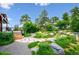 Serene backyard featuring beautifully landscaped garden and relaxing patio areas at 6565 Marshmerry Ln, Evergreen, CO 80439