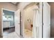 Bathroom featuring a shower and entry to the bedroom at 6565 Marshmerry Ln, Evergreen, CO 80439