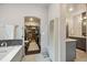 Bathroom with sink and vanity; includes closet access at 6565 Marshmerry Ln, Evergreen, CO 80439