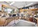 Large bonus room with musical instruments and storage, perfect for hobbies or entertainment at 6565 Marshmerry Ln, Evergreen, CO 80439