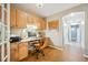 Functional home office featuring custom cabinets, granite counters, and a neutral color scheme at 6565 Marshmerry Ln, Evergreen, CO 80439