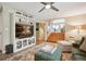 Comfortable living room featuring built-in shelving, modern decor, and plush seating at 6565 Marshmerry Ln, Evergreen, CO 80439