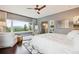 Primary bedroom features mountain views, a cozy sitting area, and ensuite bath at 6565 Marshmerry Ln, Evergreen, CO 80439