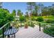 Deck overlooking yard and landscaping at 6565 Marshmerry Ln, Evergreen, CO 80439